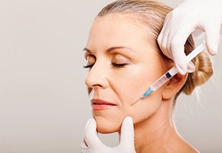 Lady receives BOTOX injection